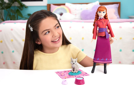 Disney Frozen Anna Fashion Doll & Wolf Cub Figure with 4 Nurturing Accessories Inspired by Movie